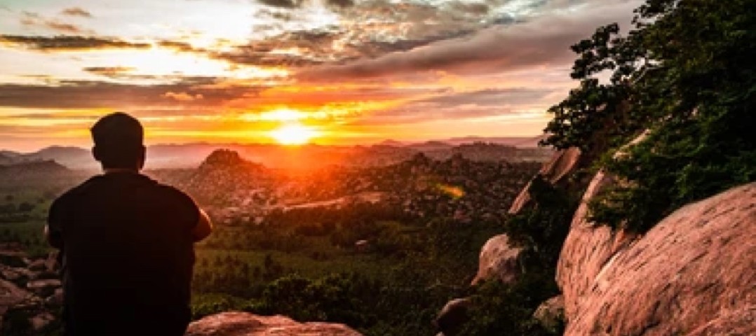 man-sitting-mountain-top-watching-260nw-1841201839.jpg copy