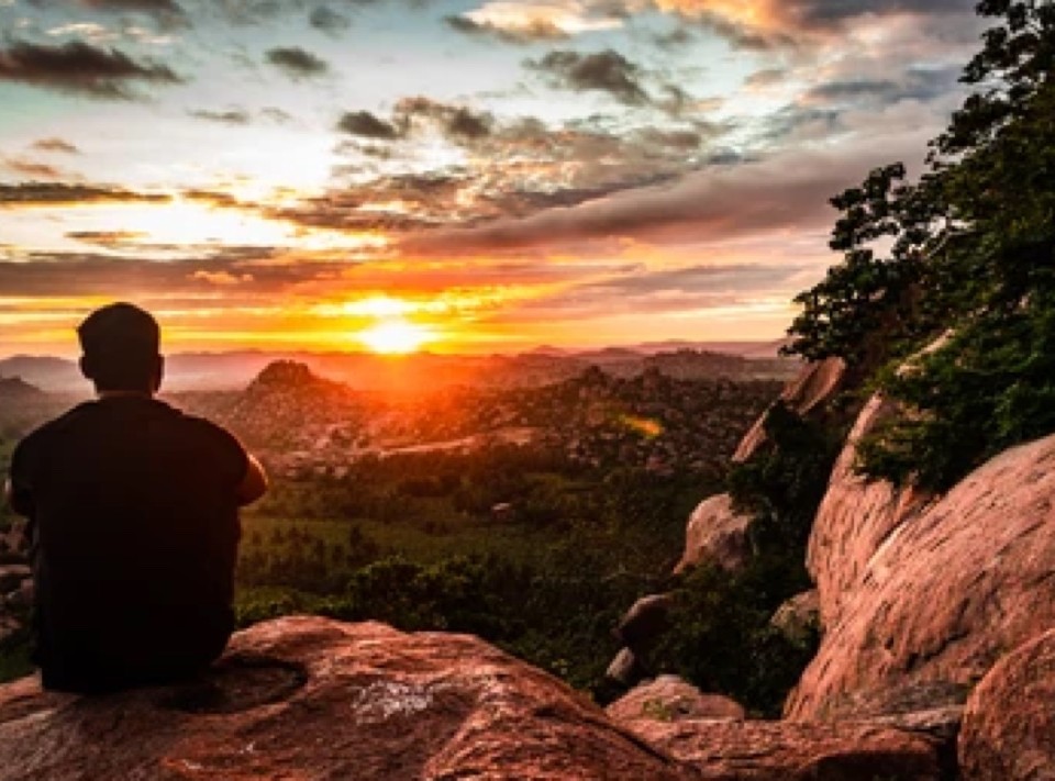 man-sitting-mountain-top-watching-260nw-1841201839.jpg copy